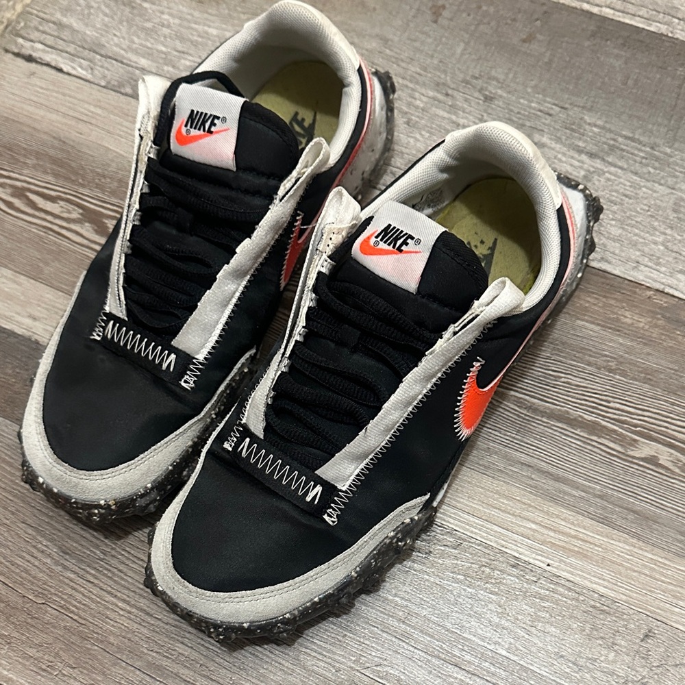 Nike Black and White Shoes with Orange Logo